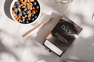 The Fleck Deck and a pen beside a bowl of yoghurt and blueberries, ready for a morning gratitude journal entry