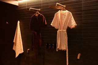 Chocolate and ecru SENA cotton robes hanging side by side