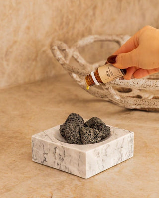Lava stones resting in the marble holder