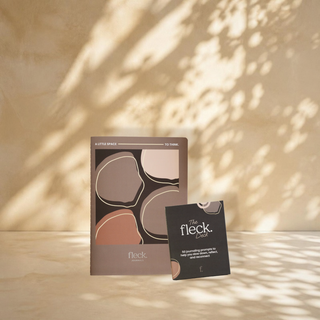 The Fleck Set: the Fleck Journal and the Fleck Deck against a leaf shadow wall